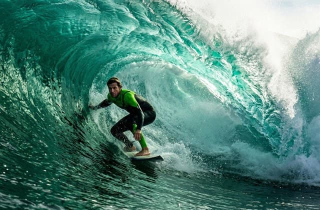 Kling 1.5 Pro surfer inside emerald Pacific barrel wave in 4K
