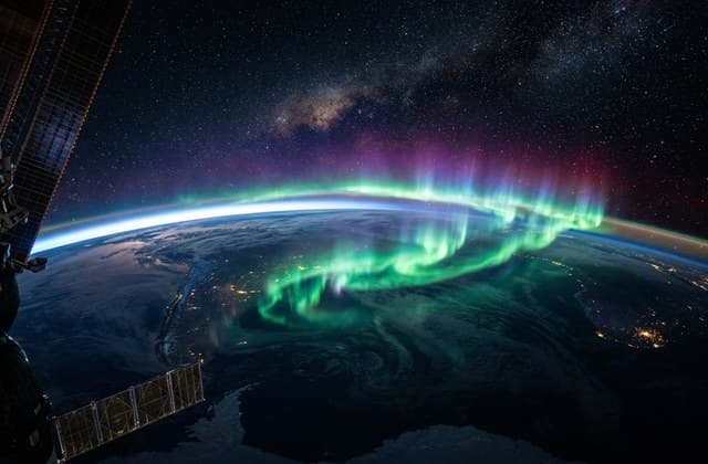 Sora 2.0 orbital perspective of planet Earth aurora